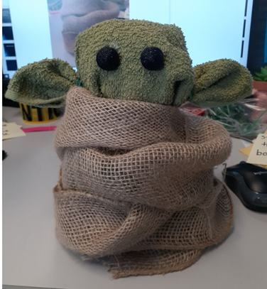 Baby Yoda made out of a washcloth and a piece of burlap.