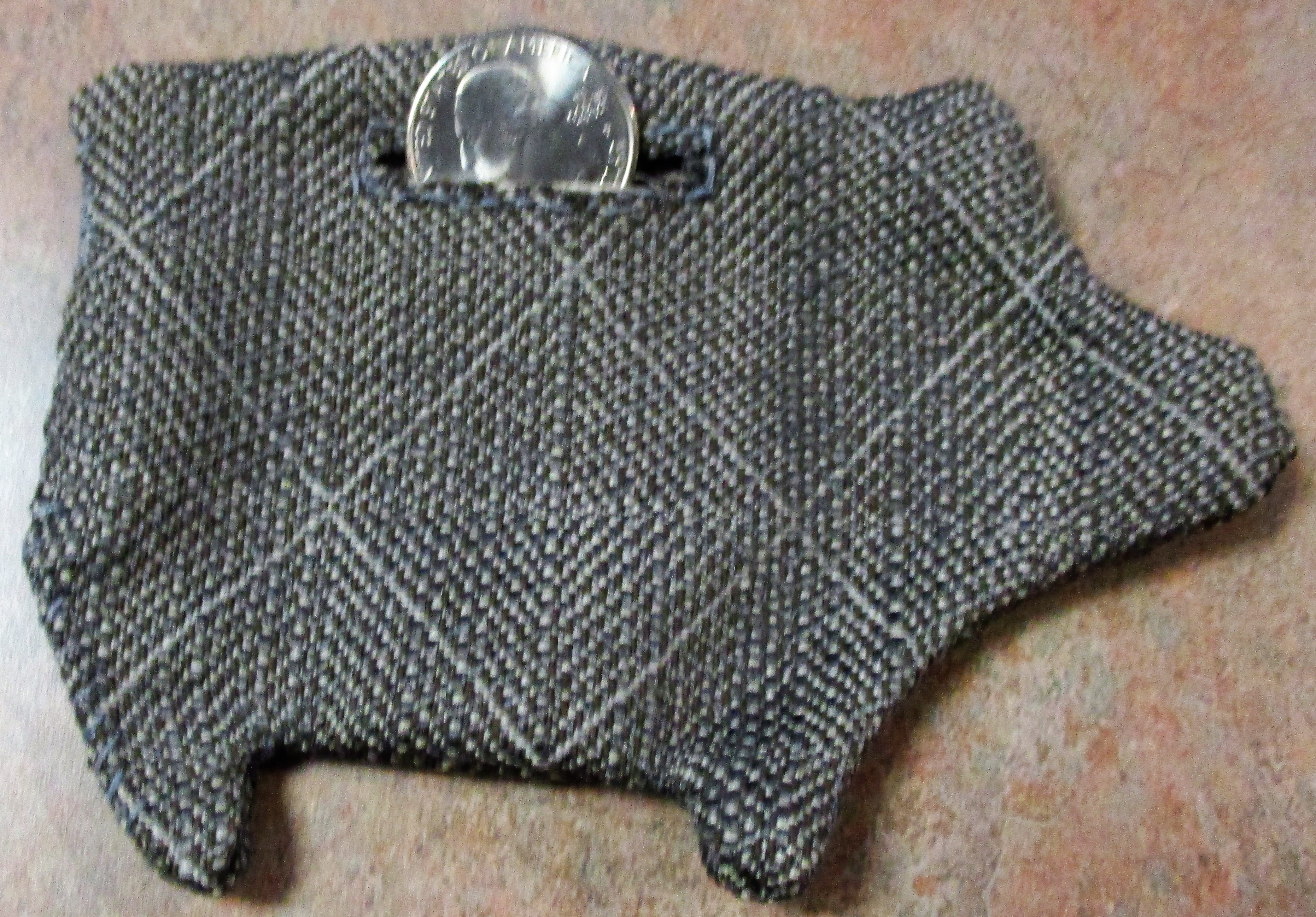 Fabric coin purse in the shape of a pig.