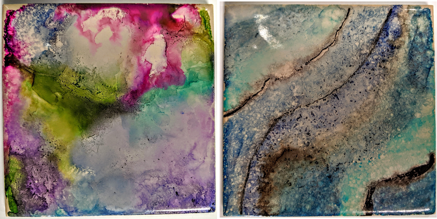 2 ceramic tiles colored with unique designs using permanent markers and rubbing alcohol.