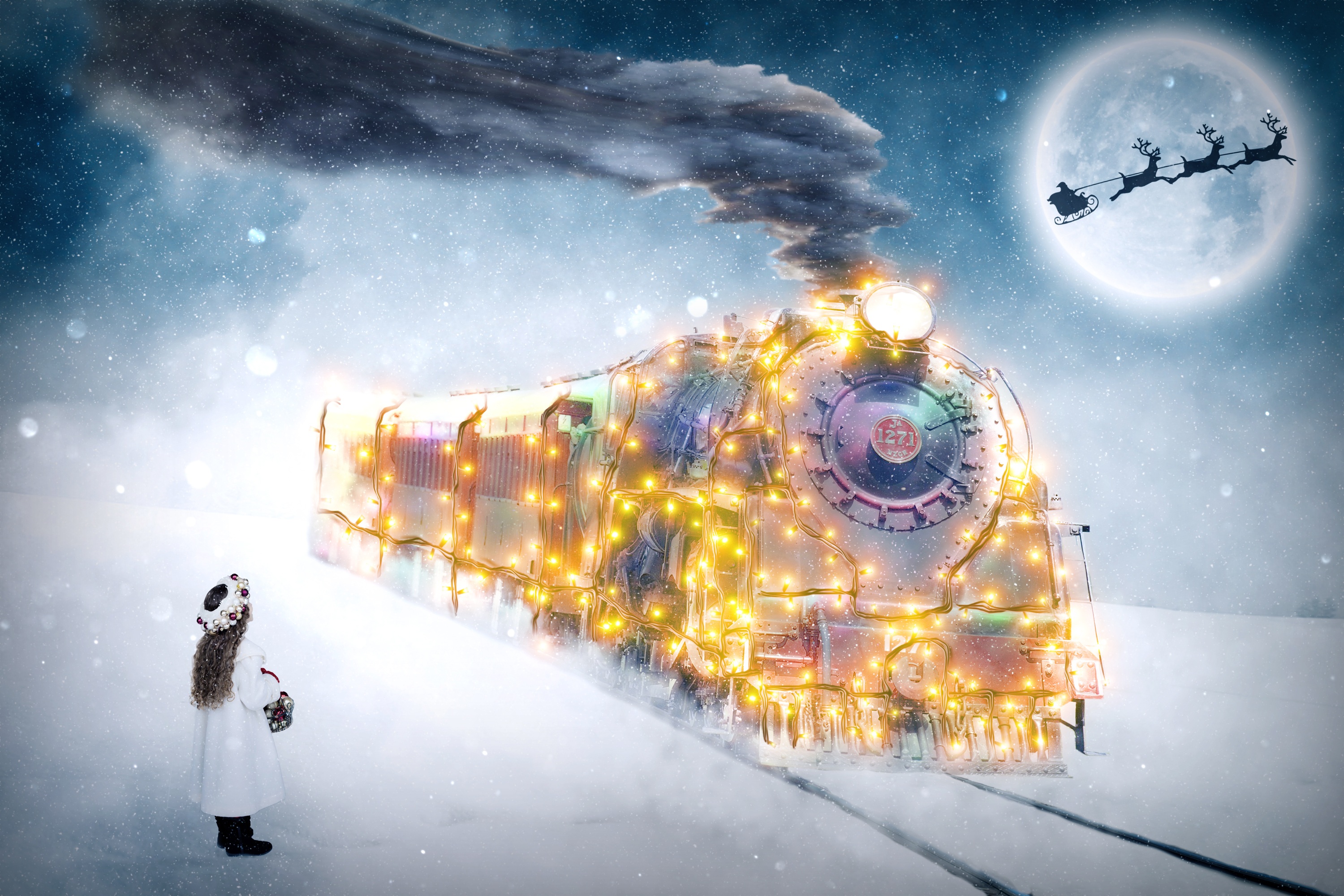Edited photo of a little girl waiting in the snow for a train covered in Christmas lights with the silhouette of Santa's sleigh across the moon.