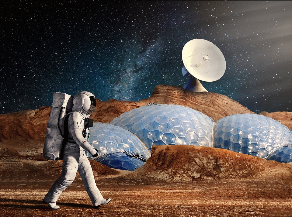 Image of a person in a spacesuit walking on a planet with space buildings and a satellite dish in the background.