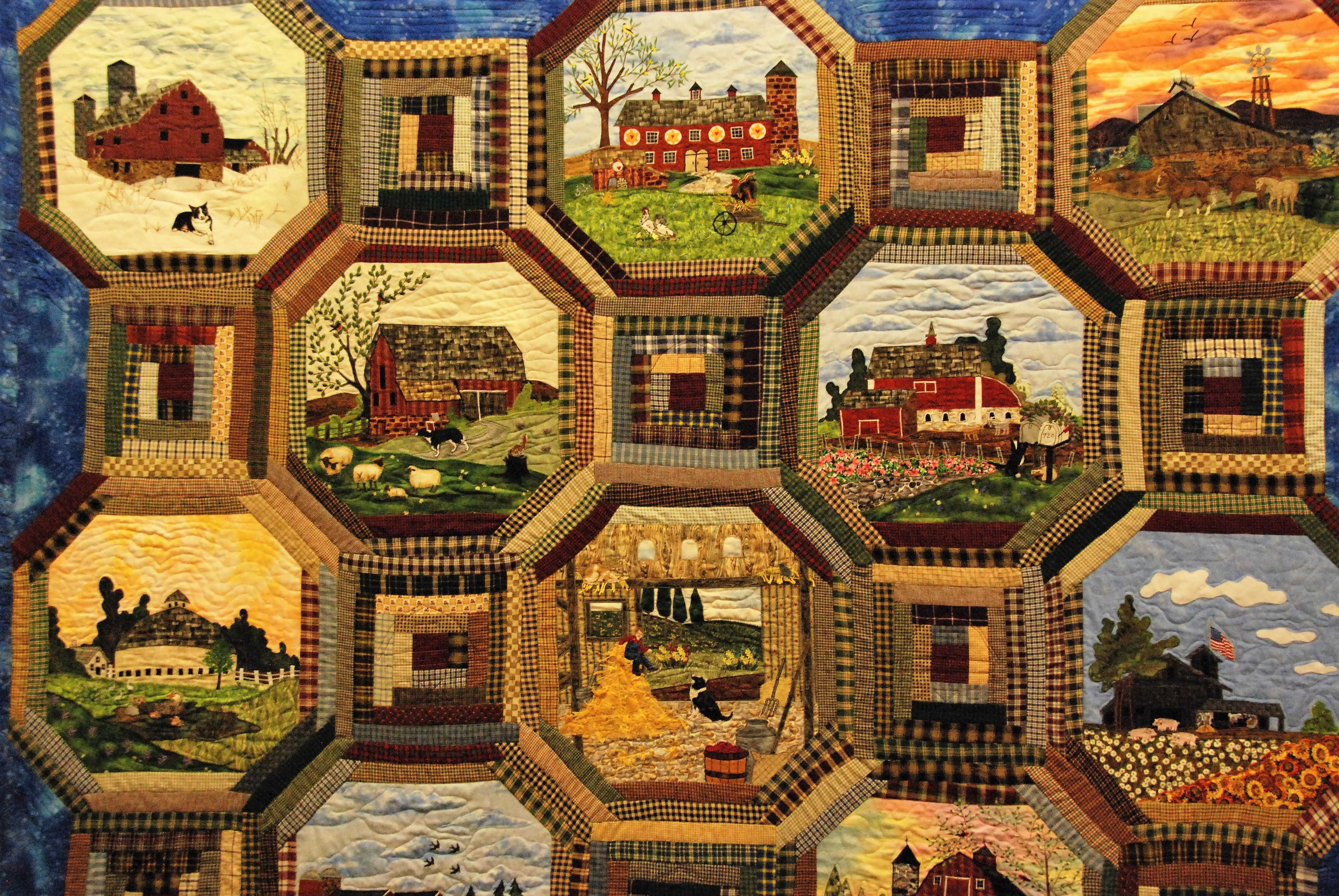 Quilt with country scenes.