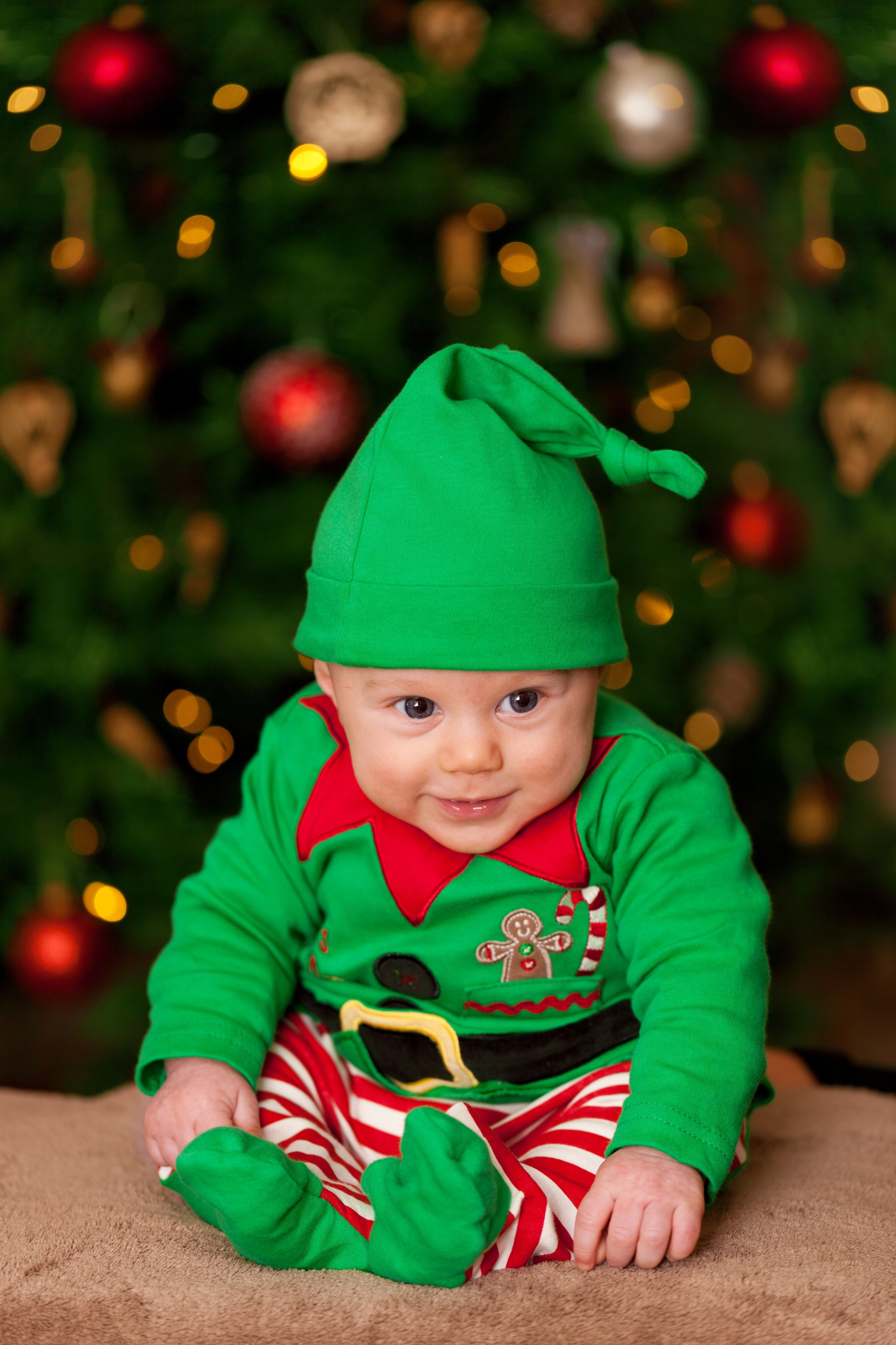 Baby dressed as an elf.