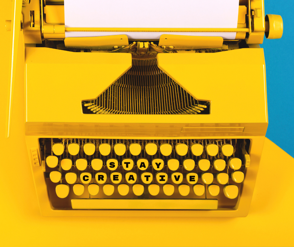 Yellow typewriter with the words Stay Creative on the keys.