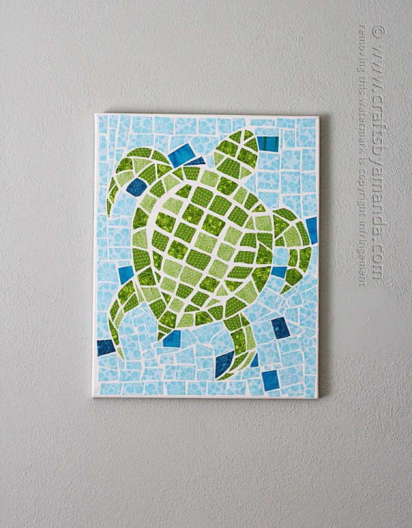 Fabric mosaic turtle on canvas.