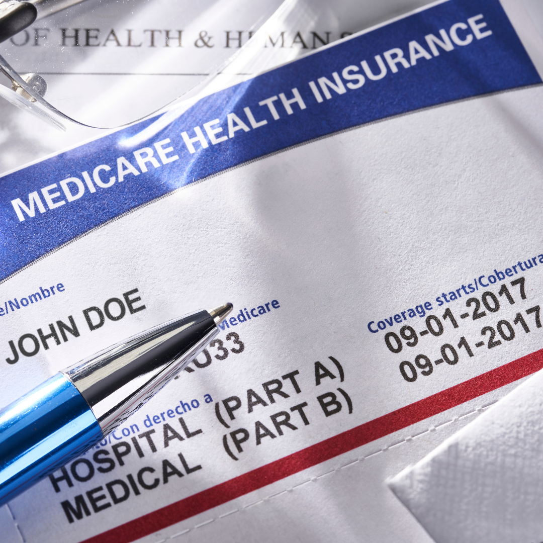 Medicare card for John Doe and a pen.