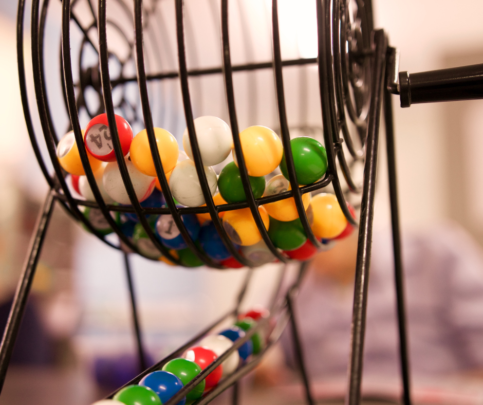 Bingo balls in a wire spinner.