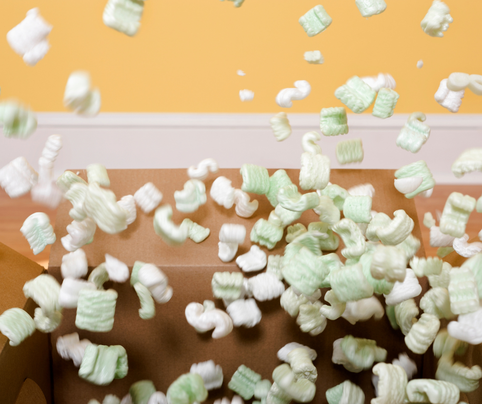 Photo of packing peanuts erupting from a box.