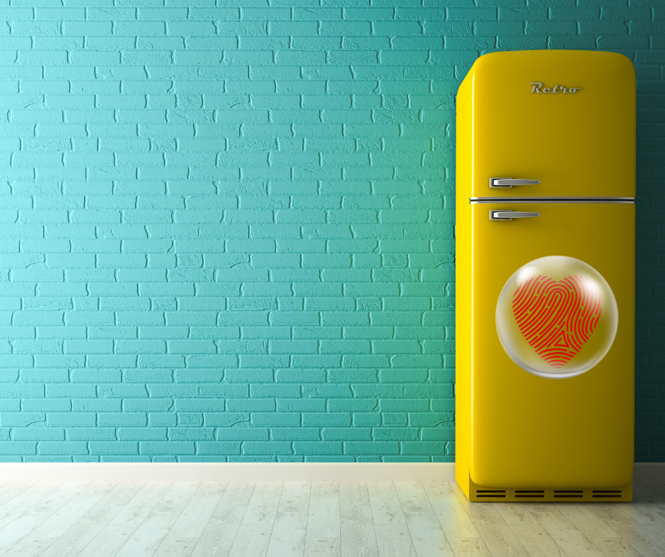 clear heart fingerprint magnet on a yellow fridge