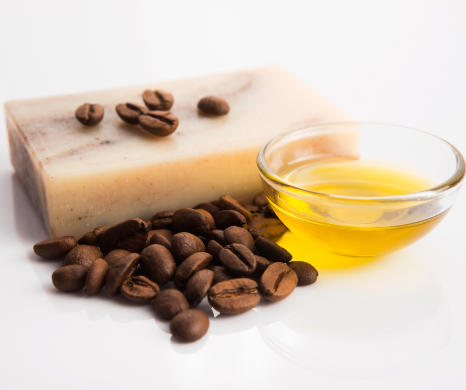 Bar of soap, coffee beans, oil in a bowl