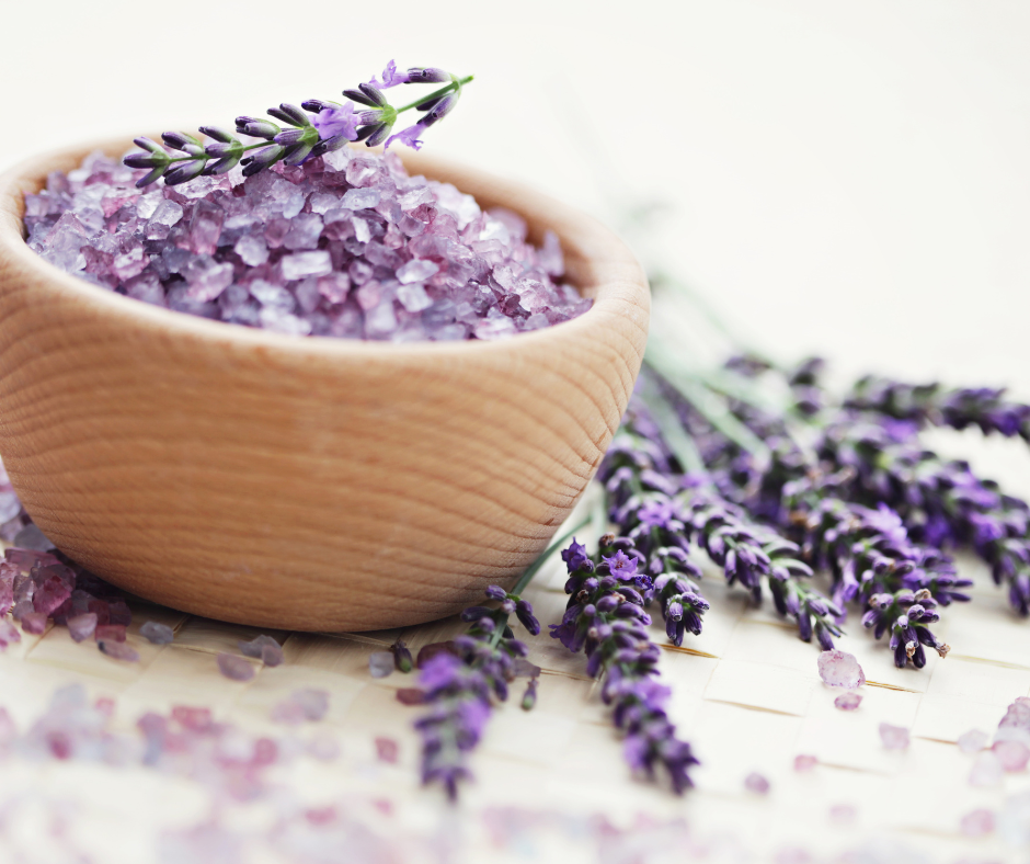 Bath salts in a wood bowl and lavender.