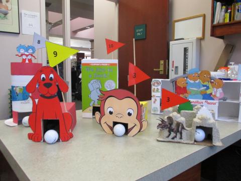 Mini-Golf holes on top of the desk at Moneta.