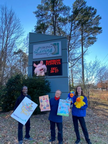 Rainbow puppet performers outside the Virginia Living Museum