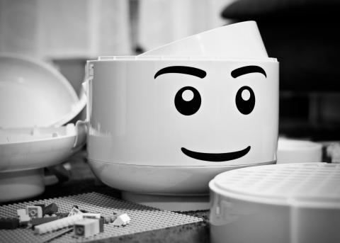 Black and white giant lego head.