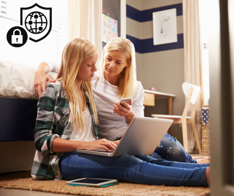 Mom and Daughter with a phone and laptop sitting on the floor and a internet safety symbol in the corner.