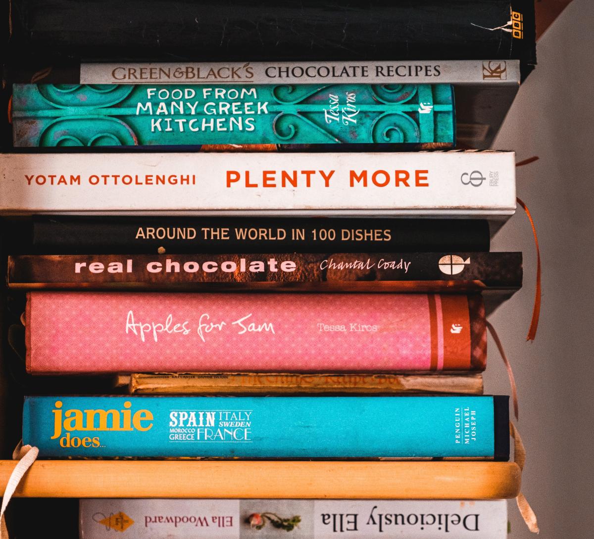 Cookbooks stacked in a pile