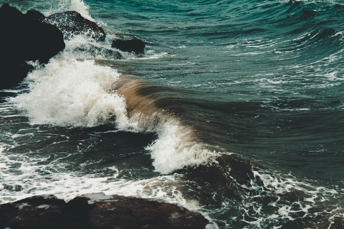 Ocean waves crashing into rocks.