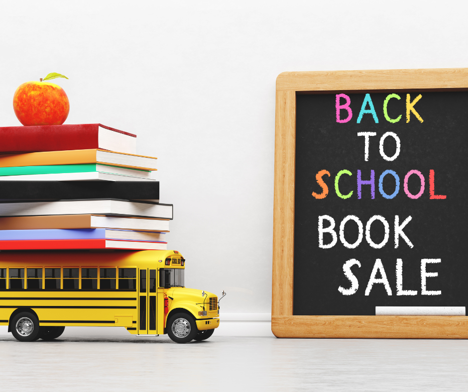 Photo of a toy school bus with books and an apple on top next to a chalk board that says Back to School Book Sale