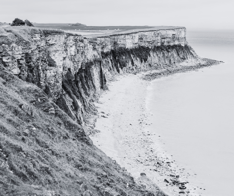 Black and white photo of Normandy Beach.